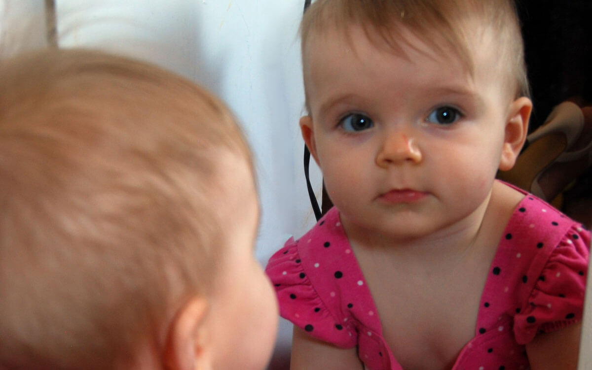 toddler in mirror