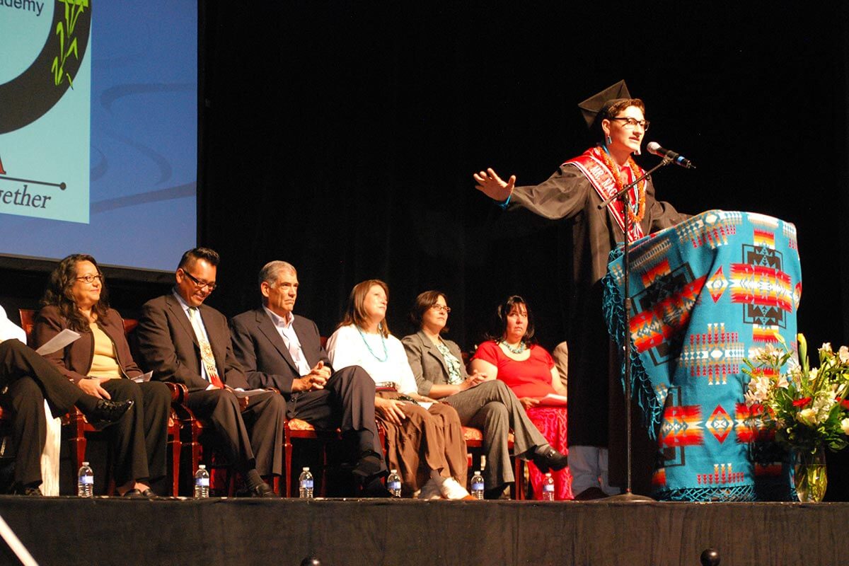 graduate talking on stage