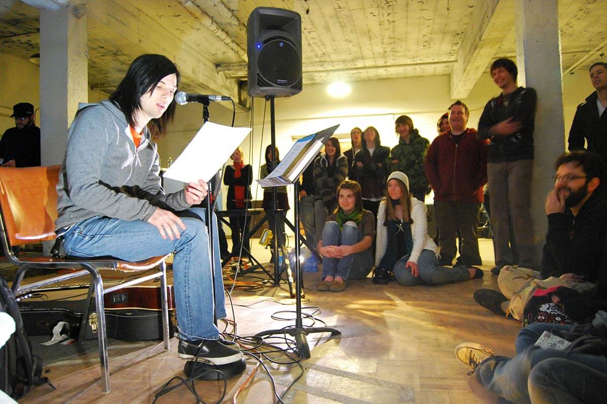 man reading for an audience