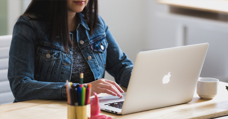 Woman using laptop at home